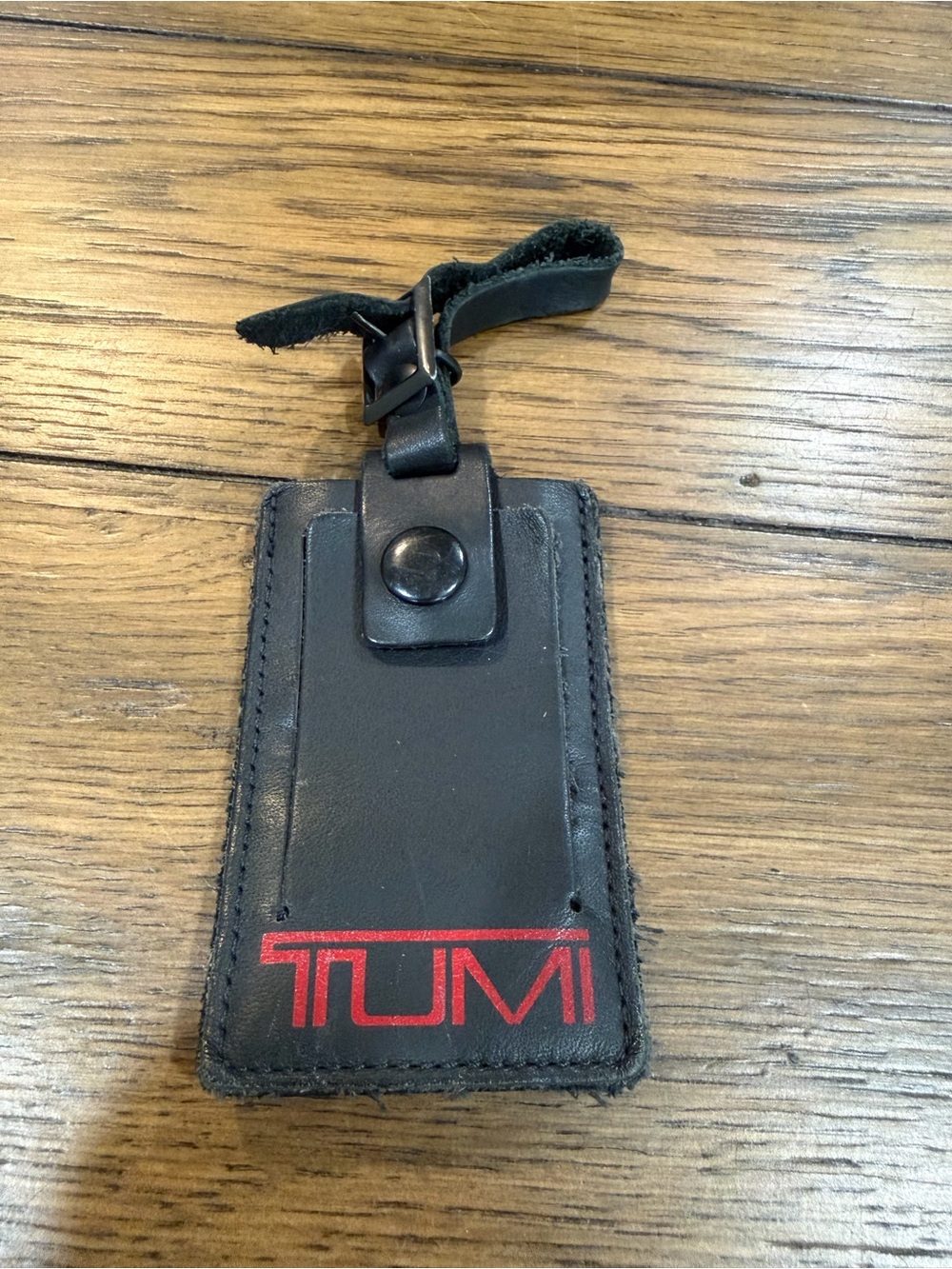 Tumi Black Leather Luggage Tag with Red Logo Accent